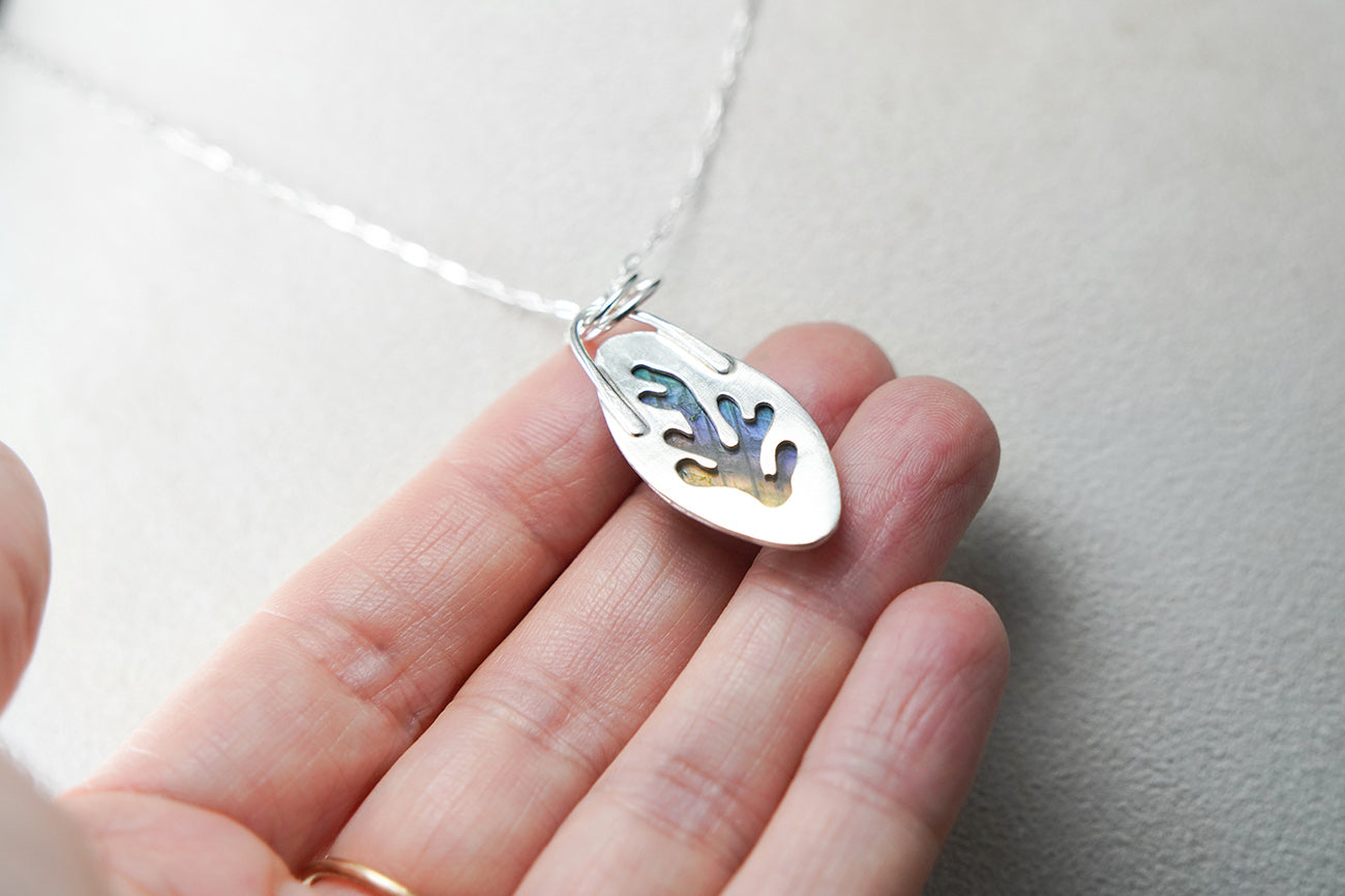 
                  
                    Navette Labradorite Decorative Coral Inspired Sterling Silver Pendant - lt. rainbow cutout back
                  
                