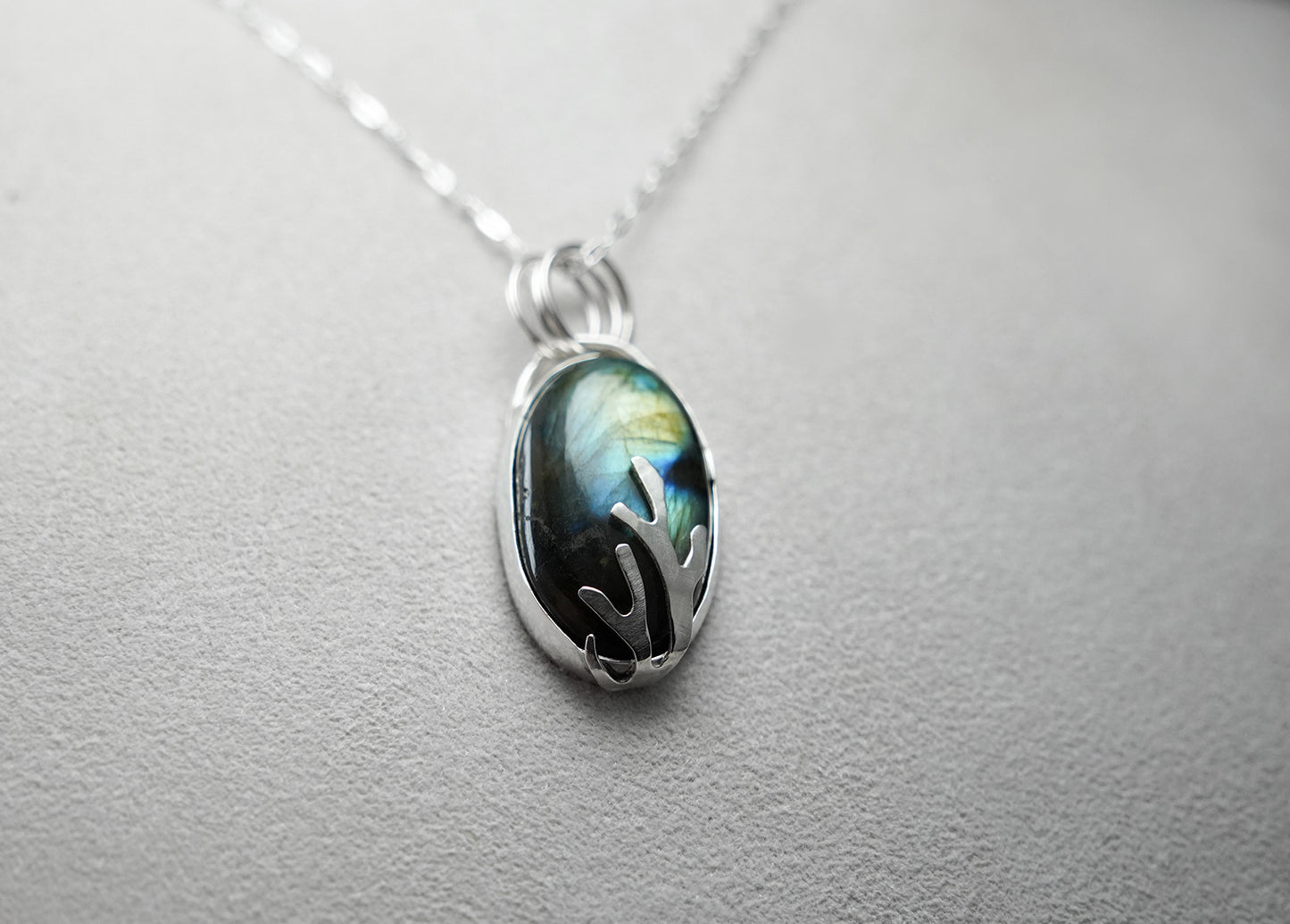 
                  
                    Oval Labradorite Decorative Coral Inspired Sterling Silver Pendant - green cutout back
                  
                