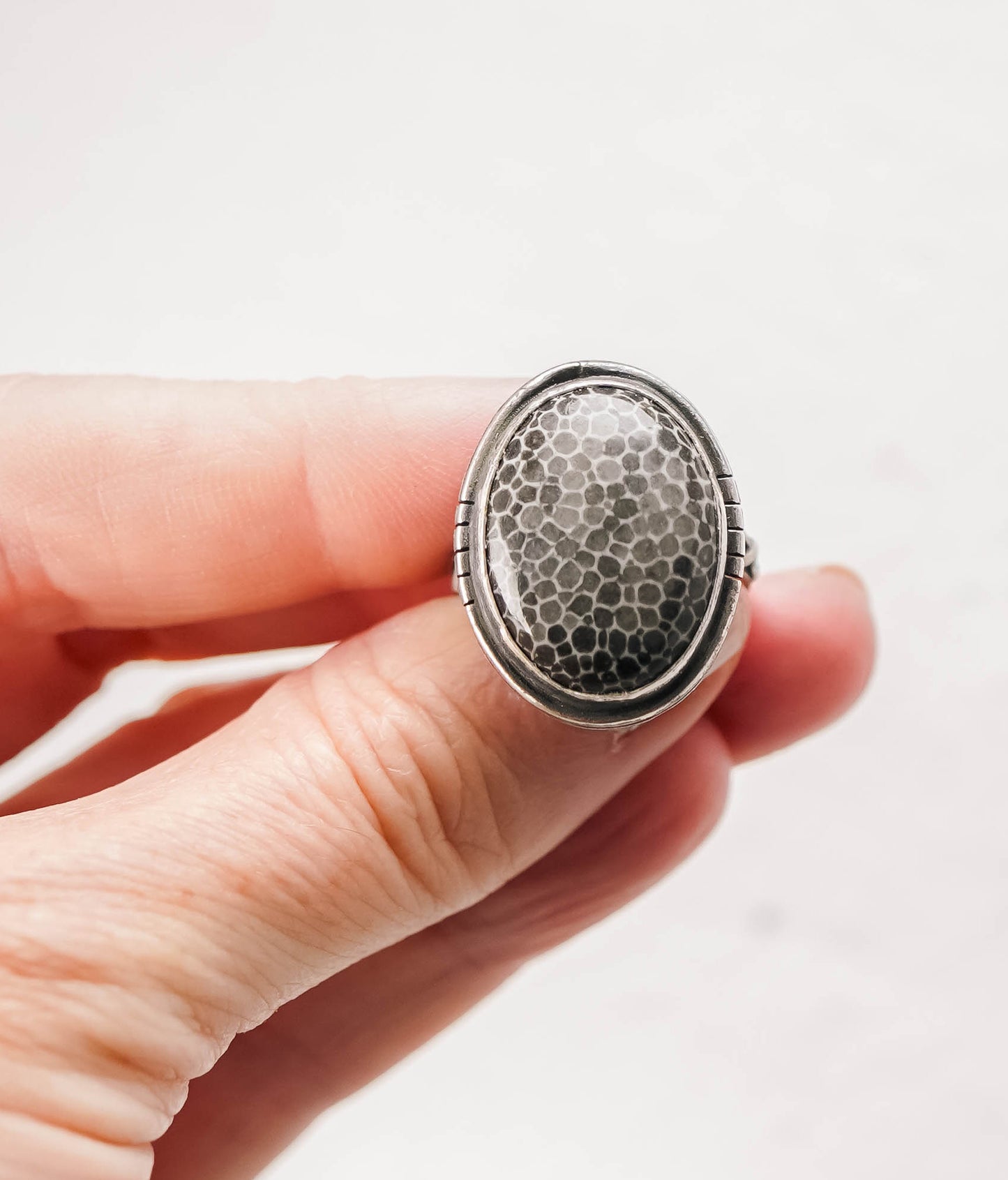 
                  
                    Fossilized Coral Oval Sterling Silver Patina Ring - Size 7
                  
                