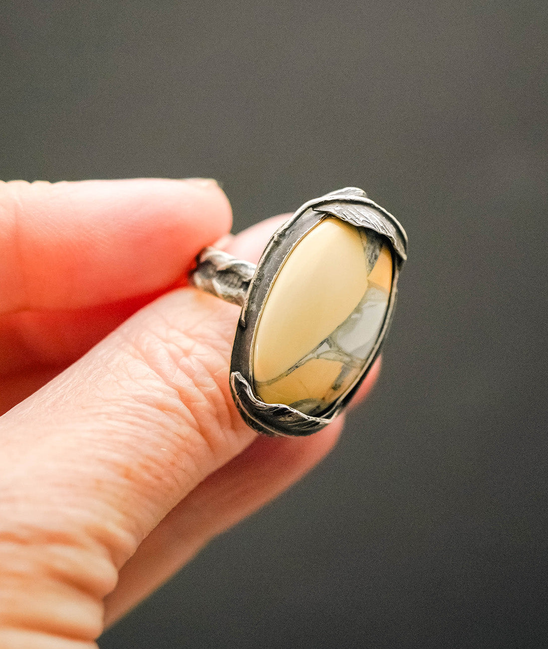 
                  
                    Maligano Jasper Oval Feather Ring with Patina– Size 7.5
                  
                